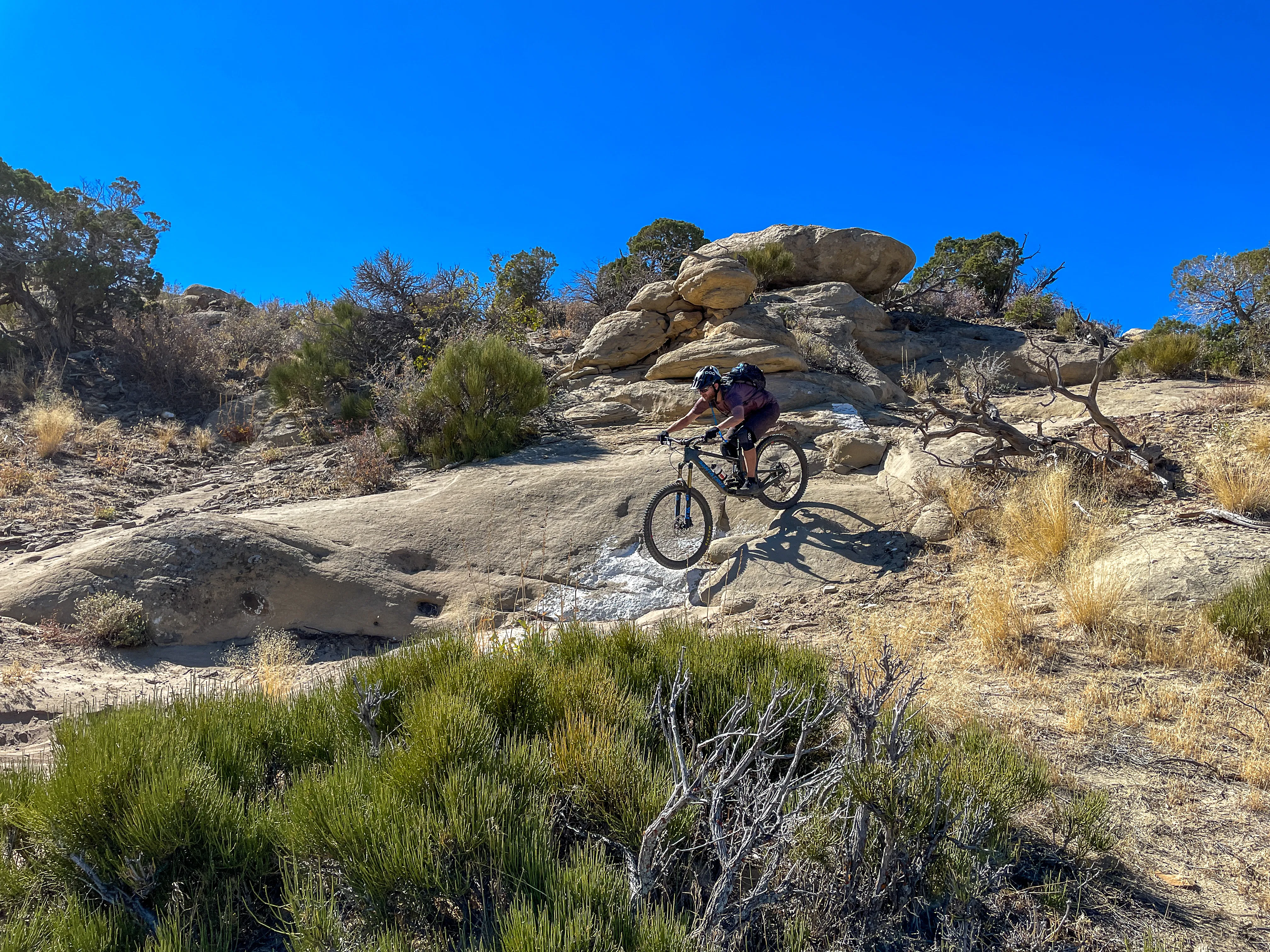 Mountain biker riding a rocky desert trail